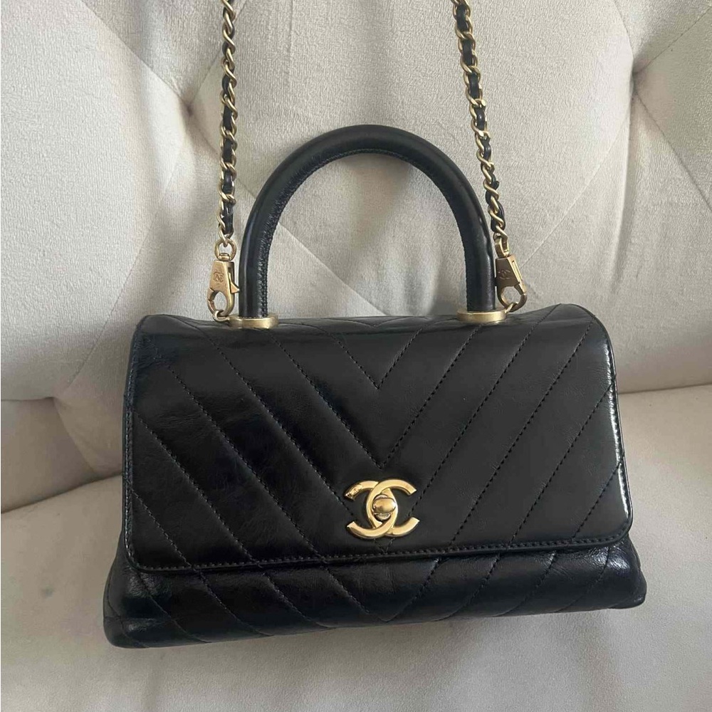 CHANEL Quilted Black Shoulder Bag with Gold Accents